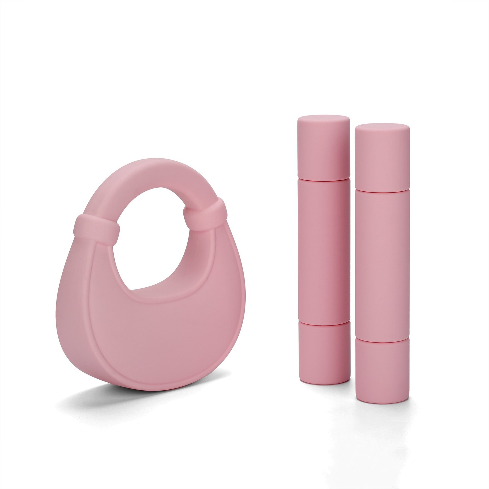 Pink magnetic adjustable silicone dumbbells paired with matching silicone fitness accessory