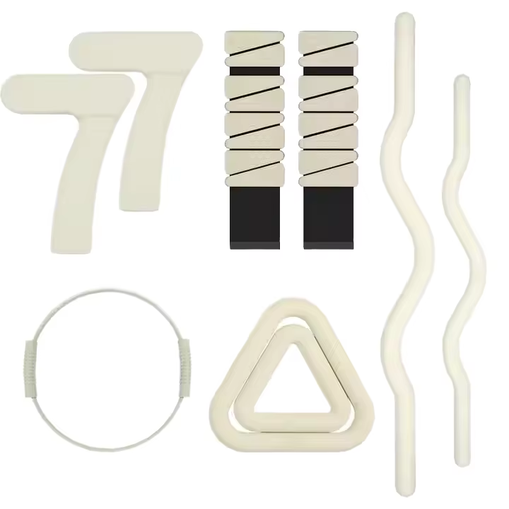cream Pilates accessories collection with wrist weights and resistance tools
