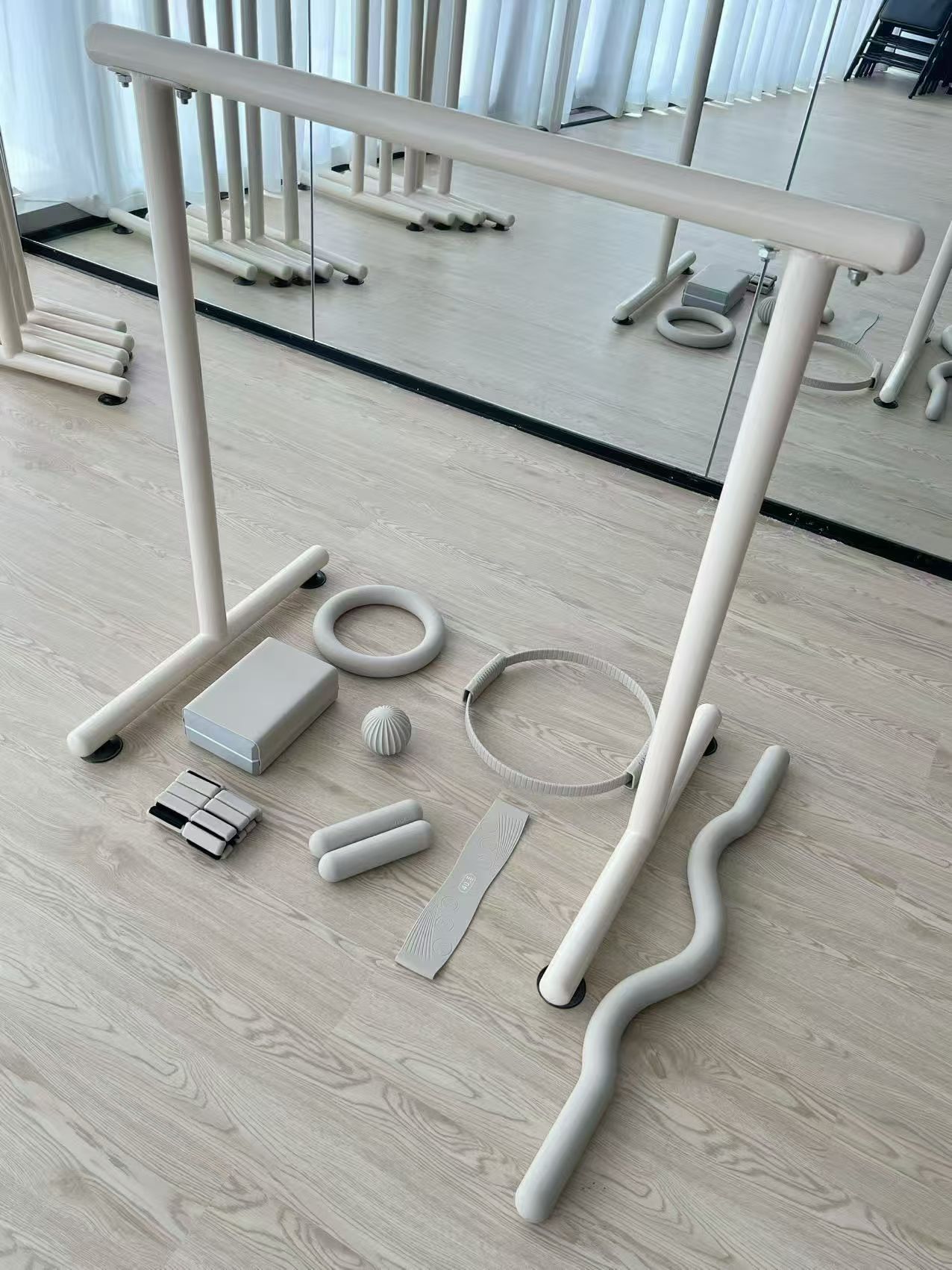 Pilates studio collection with wrist weights and matching fitness accessories